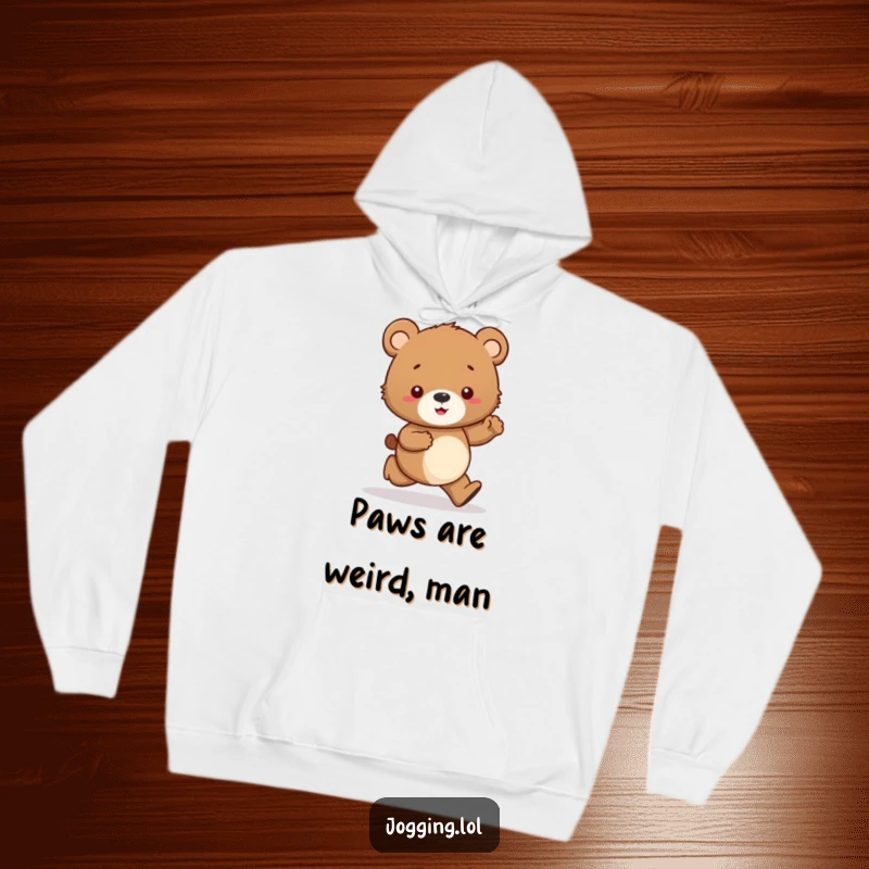 Funny hoodie depicting a curious bear cub character tentatively jogging, paws in focus, exuding relatable, humorous indecision.